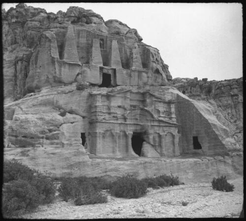 Petra [tomb with obelisks and classical tomb-Bab-al-siq ca. 1940-1946] [picture] : [Petra Valley, Jordan] / [Frank Hurley]