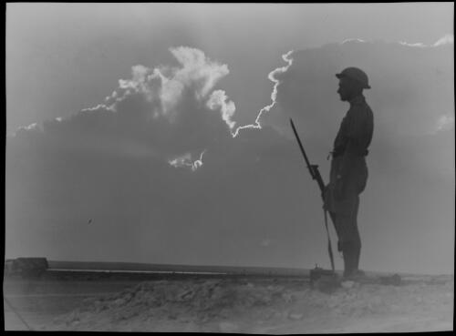 El Alamein [lone soldier on guard in silhouette] [picture] / [Frank Hurley]