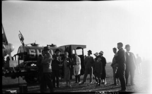 [Group of people watching an aeroplane being filled by a Shell petrol tanker] [picture] : [Blue Mountains, New South Wales] / [Frank Hurley]