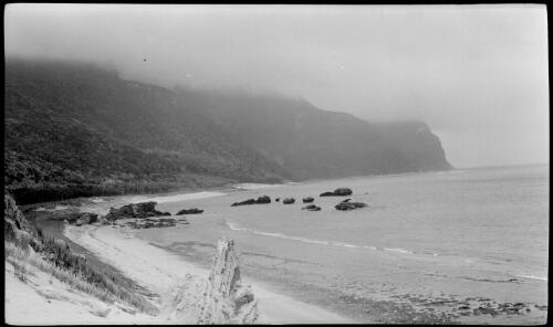 [Unidentified cove with cliff tops covered in clouds, Lord Howe Island, 1] [picture] / [Frank Hurley]
