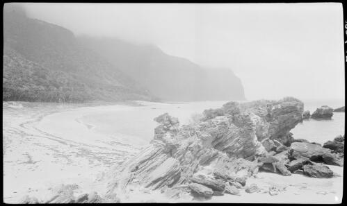 [Unidentified cove with cliff tops covered in clouds, Lord Howe Island, 2] [picture] / [Frank Hurley]