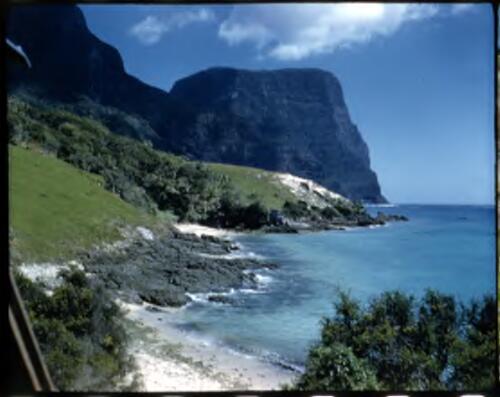 [View along beach to Mount Gower, Lord Howe Island] [transparency] / [Frank Hurley]