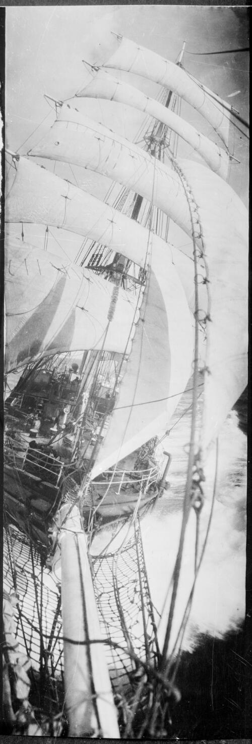 The Discovery in full sail taken from the bowsprit during the BANZ trip, 2 [picture] / [Frank Hurley]