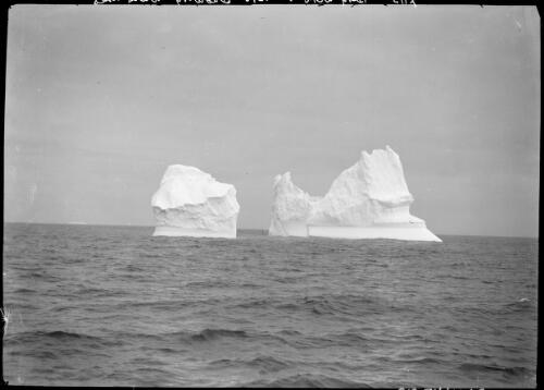 Berg with two cusps showing water lines [Australasian Antarctic Expedition, 1911-1914] [picture] / [Frank Hurley]