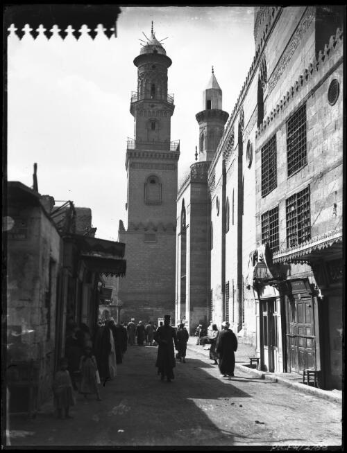 [Street and minaret in old Cairo, with figures] [picture] : [Cairo, Egypt, World War II] / [Frank Hurley]