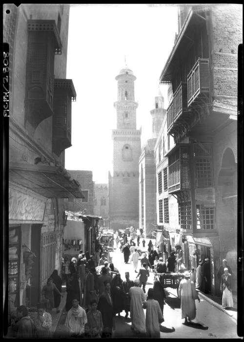 Old Cairo looking towards Mosque Qalaun Musky [street with figures] [picture] : [Cairo, Egypt, World War II] / [Frank Hurley]