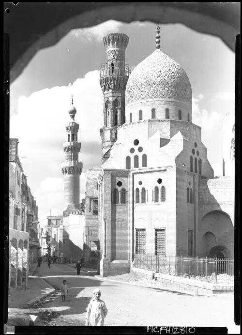Blue Mosque Cairo [through archway with clouds] [picture] : [Cairo, Egypt, World War II] / [Frank Hurley]
