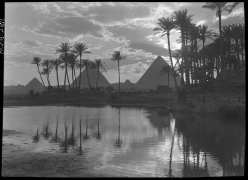 [Pyramids at Cairo with reflections and clouds] [picture] : [Cairo, Egypt, World War II] / [Frank Hurley]