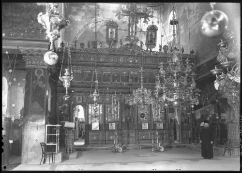 The High Altar Basilica of the Nativity Bethlehem [with one figure, ca. 1942] [picture] / [Frank Hurley]