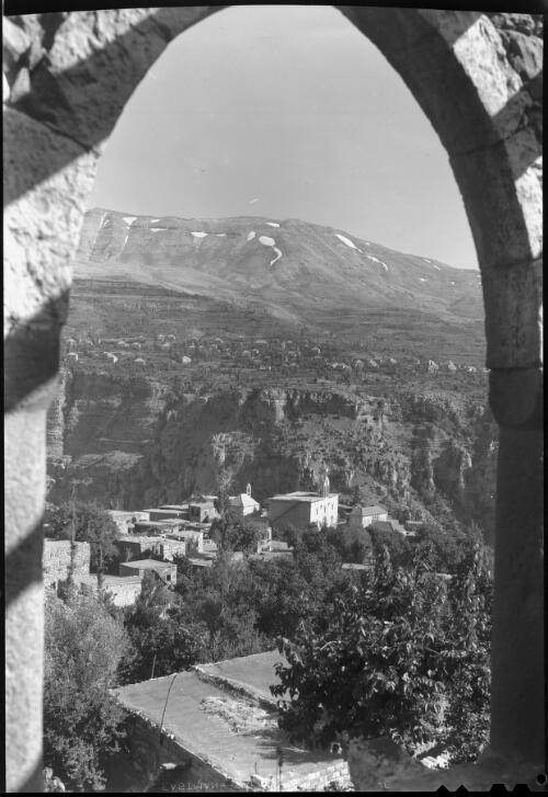 View in the Lebanons, village of Haddid in foreground [Hadchit, 3km west of Bcharre] [picture] : [Lebanon, World War II] / [Frank Hurley]