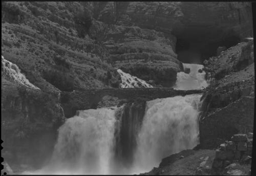 [View of water roaring under stone Roman bridge, probably at the source of Nahr Ibrahim] [picture] : [Lebanon, World War II] / [Frank Hurley]