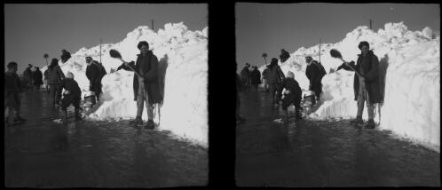 Winter scenes at Ainsofar [local men with shovels clearing snow from a road] [picture] : [Syria, World War II] / [Frank Hurley]