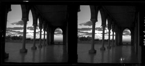 Lattique [Lattakia, covered walkway with colanades and arches, open terraced area covered with flagstones] [picture] : [Syria, World War II] / [Frank Hurley]