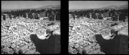 Ruins Baalbek [railway tracks through the middle of the ruin] [picture] : [Lebanon, World War II] / [Frank Hurley]