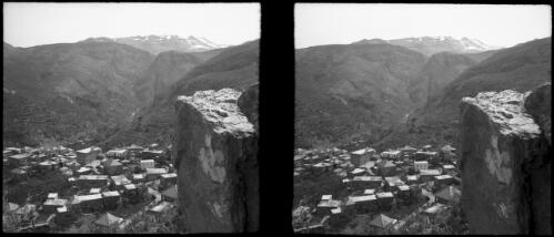 In Lebanons on way to Cedars [view from mountain ledge overlooking village rooftops] [picture] : [Lebanon, World War II] / [Frank Hurley]