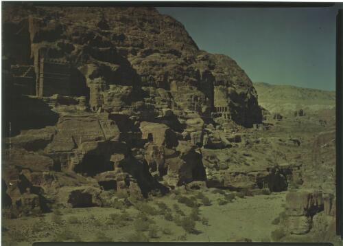 [Assyrian type monuments carved from rockface, Street of Facades?, Petra] [transparency] : [Jordan, World War II] / [Frank Hurley]