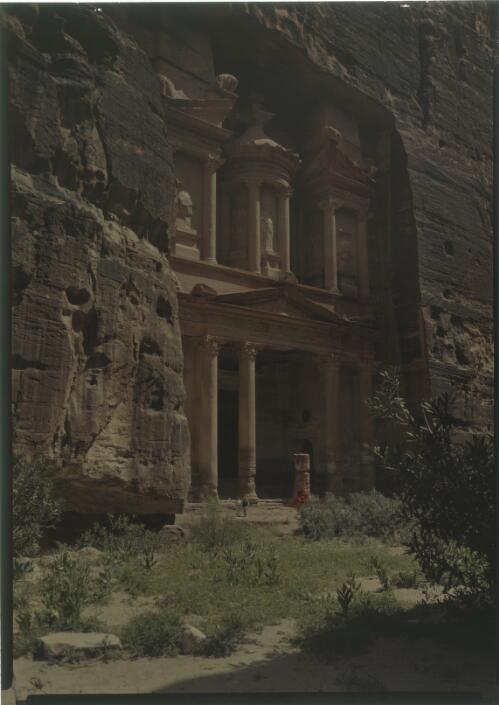 [Two figures pose for the camera in the Treasury (Al-Khazneh), Petra] [picture] : [Jordan, World War II] / [Frank Hurley]
