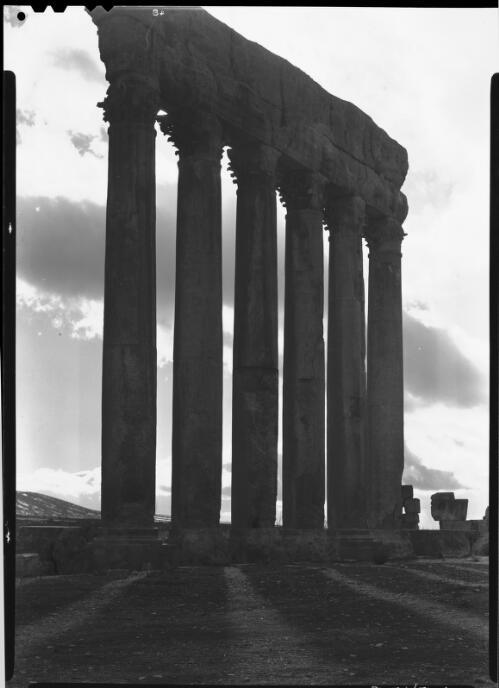Ruins of Baalbek, Syria [columns of the Temple of Jupiter] [picture] : [Lebanon, World War II] / [Frank Hurley]