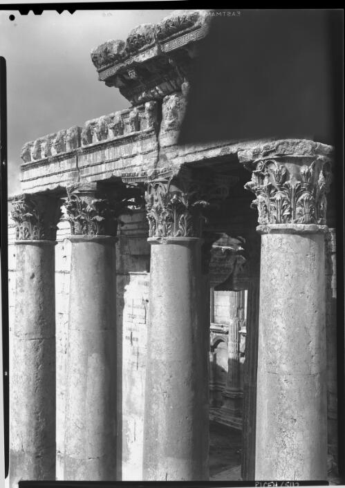 Temple Bacchus Baalbek [detail of unfluted columns and entableture, with glimpse of interior niche] [picture] : [Lebanon, World War II] / [Frank Hurley]