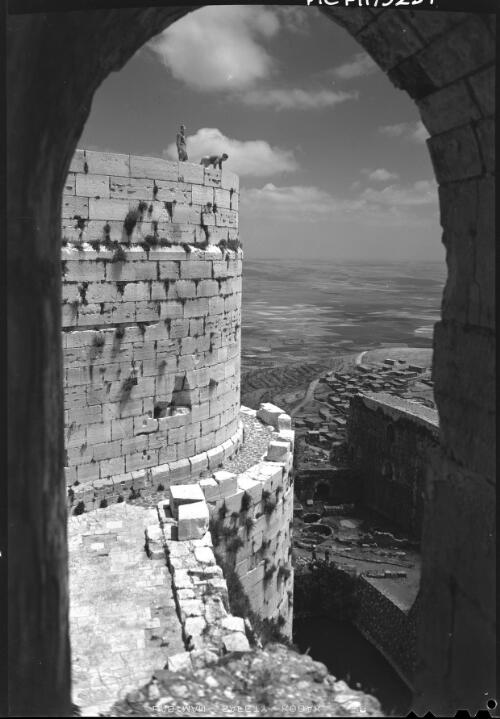 [View through a stone arch in the Crac des Chevaliers, World War II] [picture] / [Frank Hurley]
