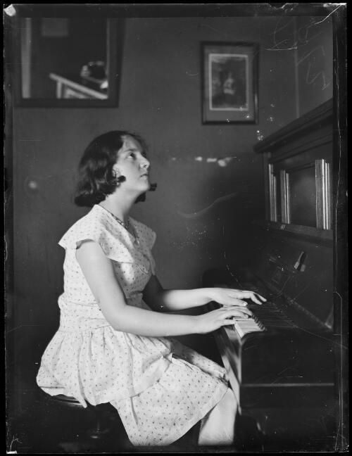 14 year old pianist Nancy Weir playing the piano at Palings, New South Wales, 27 February 1930 [picture]