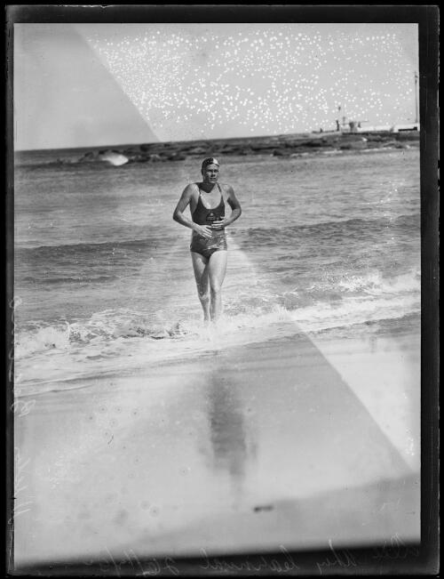 Swimmer Victor Besamo emerging from the ocean at a Dee Why Carnival, 26 December 1932 [picture]