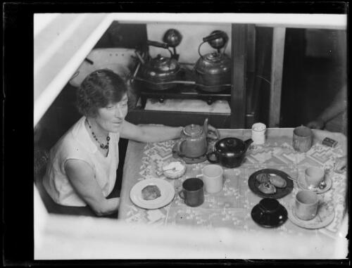 Mrs Murray [?] at a table set for tea onboard the yacht day Dream, Rushcutters Bay, New South Wales, 22 December 1931 [picture]