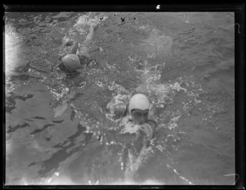 Australian swimmer Kitty Mackay and English swimmer Joyce Cooper swimming together, New South Wales, 8 January 1934, 1 [picture]