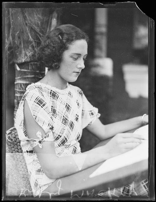 Australian swimmer Kitty Mackay sitting on a chair outdoors drawing, New South Wales, 3 February 1934, 2 [picture]