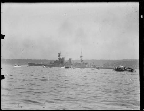 H.M.S. Hood in the water surrounded by boats and ferries, New South Wales, ca. 1934 [picture]