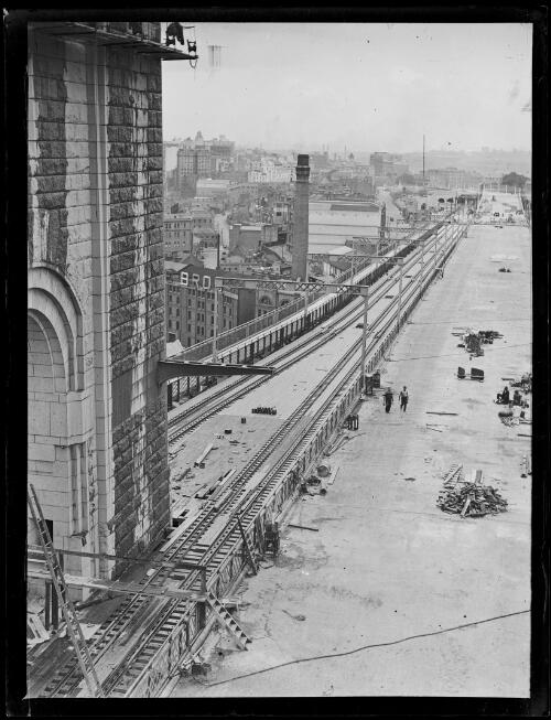 Sydney Harbour Bridge under construction from Milson's Point railway station, New South Wales, ca. 1926 [picture]