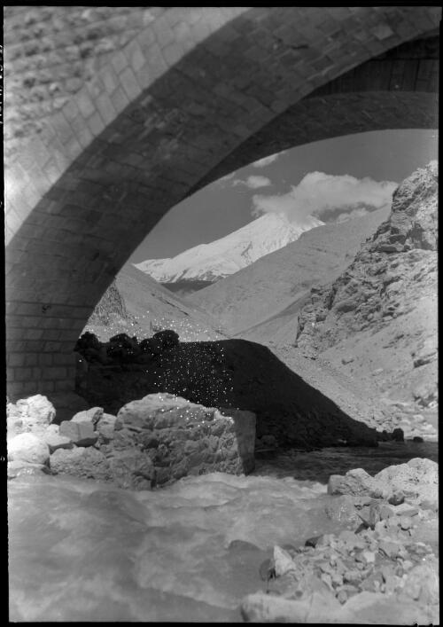 Mountain scene with fast moving stream taken from beneath a stone bridge, Iran, ca. 1943 [picture] / [Frank Hurley]
