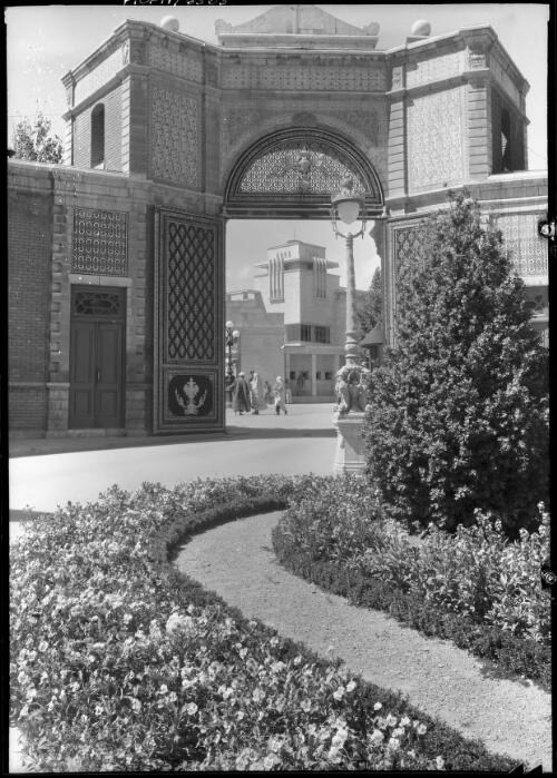 Looking from the entrance to Shah Riza Pahlavi's Palace to the modern town palace of H.I.M. the Shah of Persia in Teheran [ca. 1940-1946] [picture] : [Iran] / [Frank Hurley]