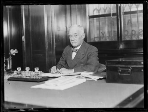 Frederick T. Bridges sitting at his desk, New South Wales, ca. 1932 [picture] / Ray Olsen