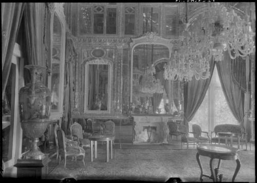 Richly decorated interior of Marble Palace including chandeliers and gilt framed mirrors, Tehran, Iran, ca. 1943 [picture] / [Frank Hurley]