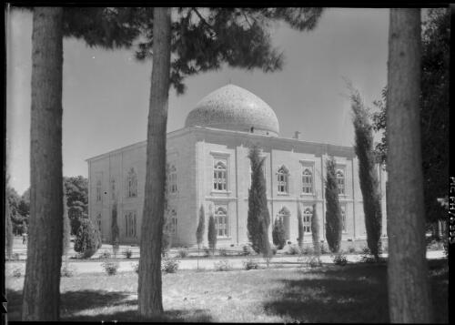 Front and side view of Marble Palace with ornate window frames and an elaborately decorated dome on top, Tehran, Iran, ca. 1943 [picture] / [Frank Hurley]
