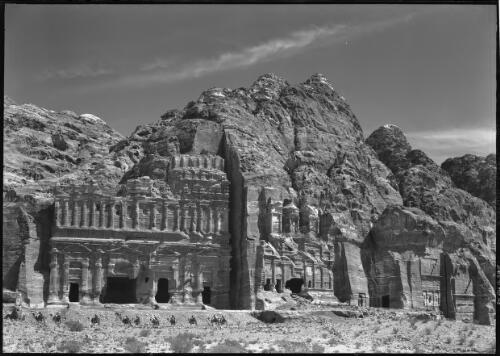 [General view of the Palace, the Corinthian Tomb, and the Urn Tomb, Petra] [picture] : [Petra Valley, Jordan] / [Frank Hurley]