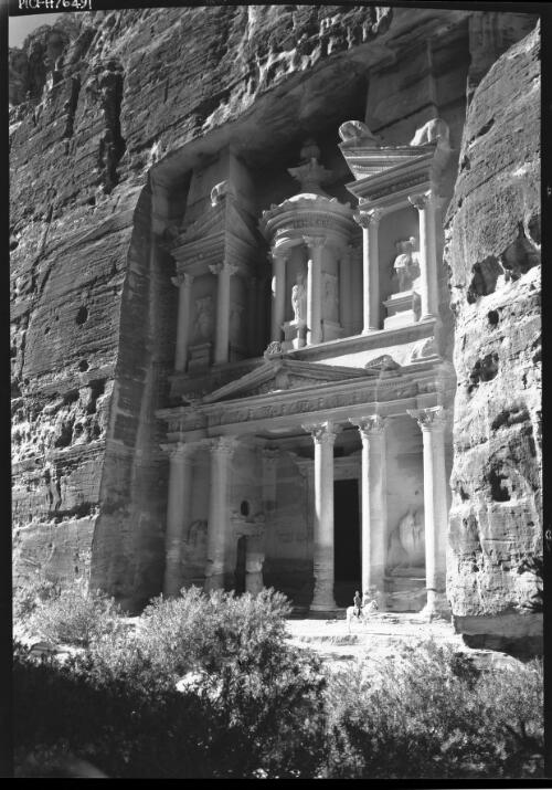 El Khazna Petra [exterior view, man on horse at entrance] [picture] : [Petra Valley, Jordan] / [Frank Hurley]