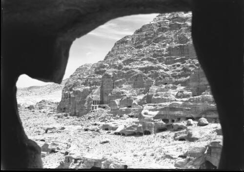 [Distant view of the Urn Tomb, Petra] [picture] : [Petra Valley, Jordan] / [Frank Hurley]