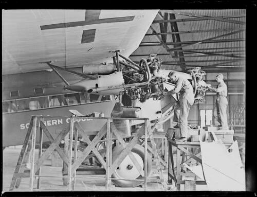 Mechanics working on the Southern Cross aeroplane, Mascot, New South Wales, ca. 1928 [picture]