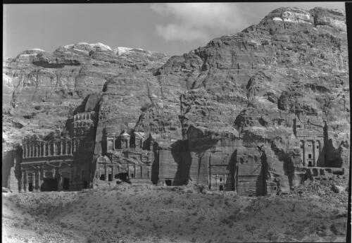 Group of Temple Tombs [general view of the Royal Tombs, including the Palace, the Corinthian Tomb, the Silk Tomb, and the Urn Tomb, Petra] [picture] : [Petra Valley, Jordan] / [Frank Hurley]