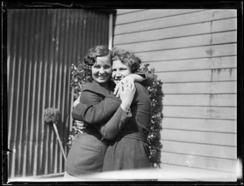 Swimmer Clare Dennis hugging a family member at her home, New South Wales,11 August 1932 [picture]