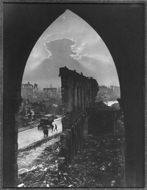 The ruins of the Cloth Hall during the Third Battle of Ypres, view through a cloister window [picture] / Frank Hurley