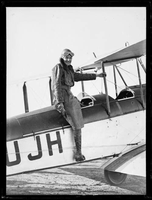 Aviatrix Irene Williams getting into her plane for her Perth to Sydney flight, Adelaide, 23 April 1932 [picture]