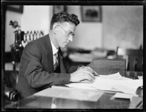 Mr Hatfield, new Secretary of the Returned Sailors and Soldiers Imperial League of Australia, sitting at his desk, New South Wales, ca. 1930s, 2 [picture]