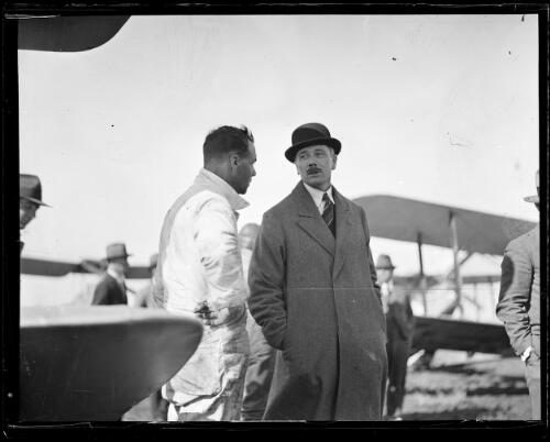 Aviator Herbert Hinkler talking with another man, New South Wales, ca. 1930 [picture]