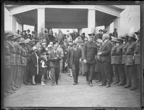 Aviator Herbert Hinkler walking through a Guard of Honour, New South Wales, ca. 1930 [picture]