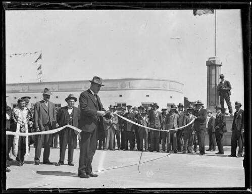 Jack T. Lang cutting the ribbon to open the southern end of the Sydney Harbour Bridge, Sydney, 19 March 1932 [picture]