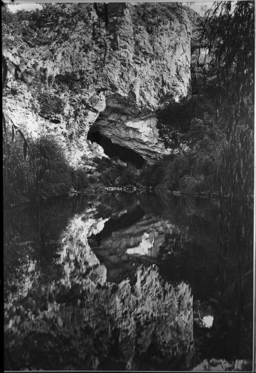 [The Grand Arch across the Blue Lake] [picture] : [Jenolan Caves, New South Wales] / [Frank Hurley]