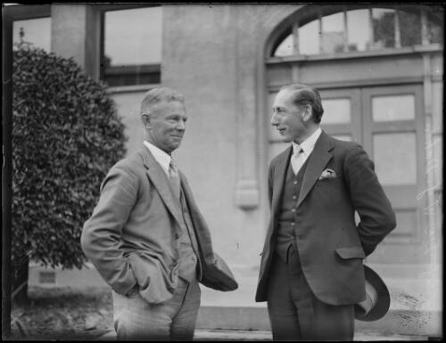 Professor W. J. Dakin and Mr F. A. Eastnough talking together outside a building, New South Wales, 18 October 1933 [picture]